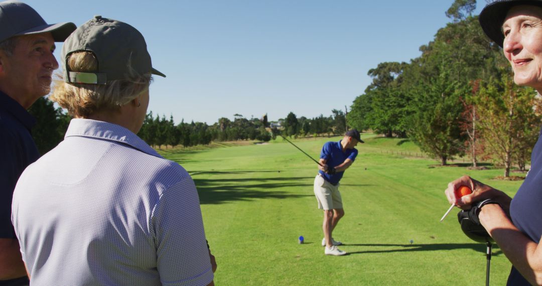 Senior Golf Enthusiasts Enjoying a Game in Lush Green Setting