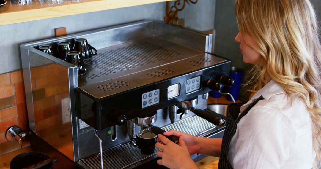 Barista Making Coffee with Espresso Machine in Coffee Shop - Free Images, Stock Photos and Pictures on Pikwizard.com