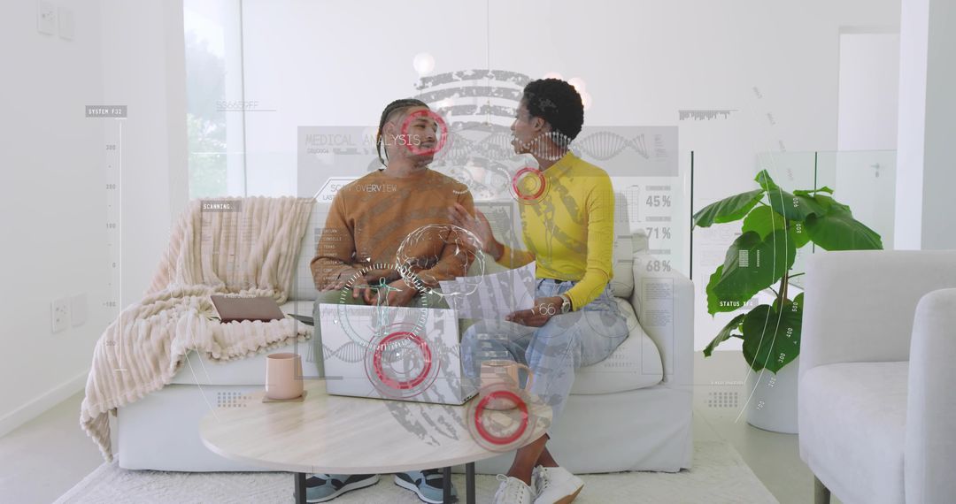 Colleagues collaborating on laptop with augmented reality interface in modern living room