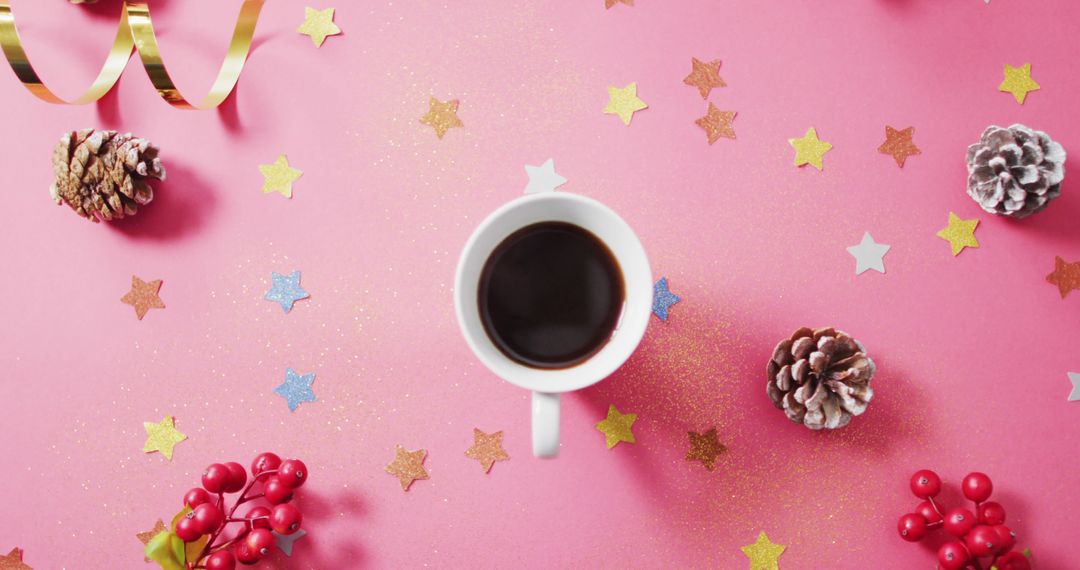 Image of coffee, red berries, stars and pine cones on pink background - Free Images, Stock Photos and Pictures on Pikwizard.com