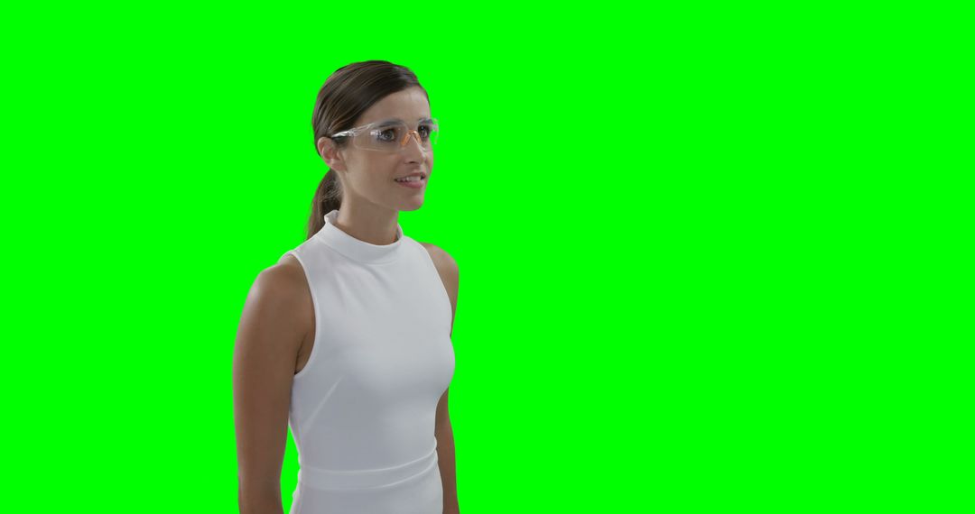 Confident Business Woman Wearing Protective Glasses on Green Screen Background - Free Images, Stock Photos and Pictures on Pikwizard.com