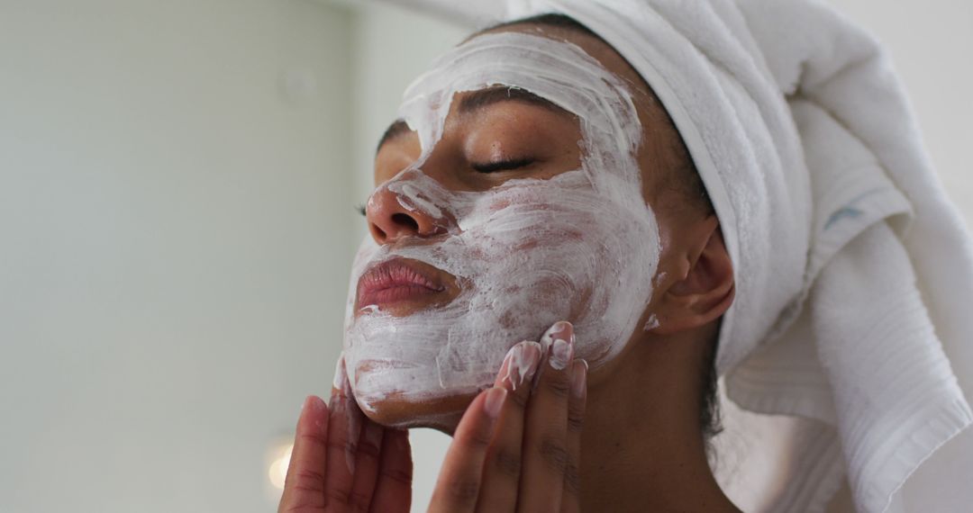 Woman Applying Face Mask for Skincare Routine - Free Images, Stock Photos and Pictures on Pikwizard.com