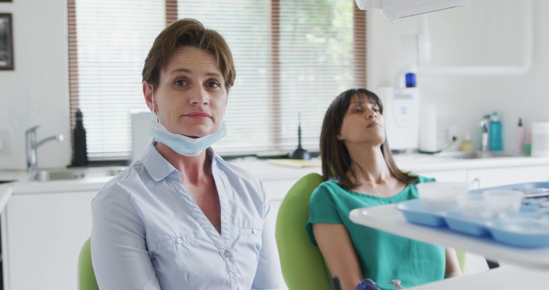 Confident Female Dentist with Patient in Chair - Free Images, Stock Photos and Pictures on Pikwizard.com