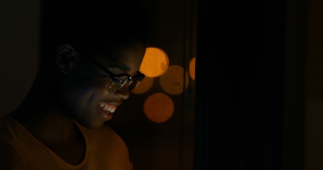 Smiling Young Woman Using Digital Device at Night with City Lights - Free Images, Stock Photos and Pictures on Pikwizard.com