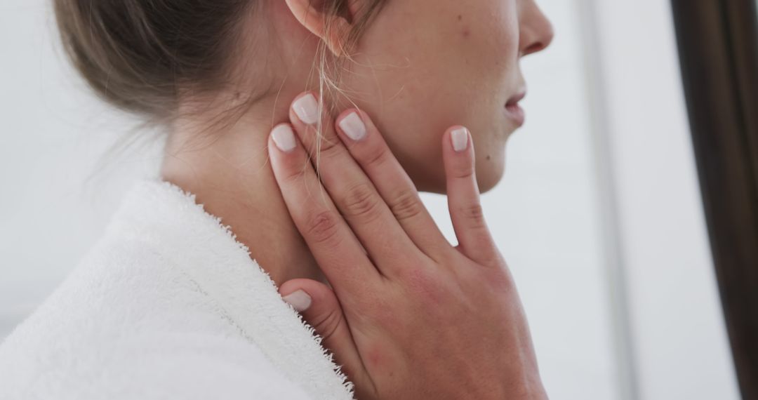 Close-Up of Woman's Neck with Hand Touching - Free Images, Stock Photos and Pictures on Pikwizard.com