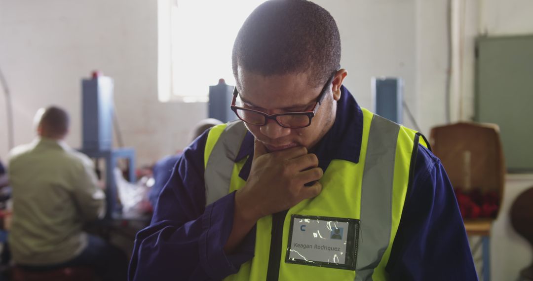 African American Male Supervisor In Reflective Vest At Workspace - Free Images, Stock Photos and Pictures on Pikwizard.com