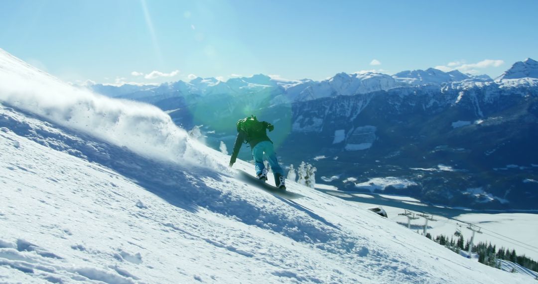 A snowboarder carves through fresh powder on a mountain slope, with copy space - Free Images, Stock Photos and Pictures on Pikwizard.com