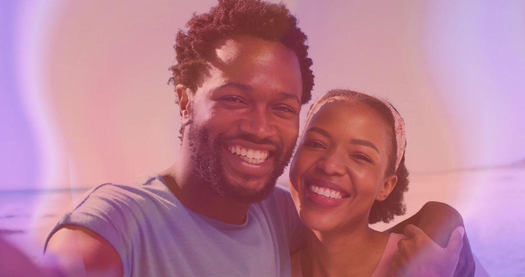 Couple Smiling with While Taking Selfie on Scenic Beach