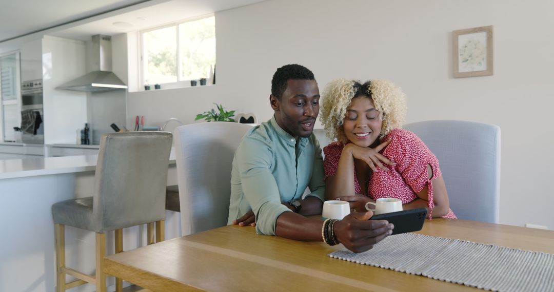 Couple Enjoying Coffee and Smartphone Entertainment at Home