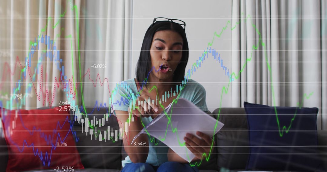 African American Woman Analyzing Financial Charts at Home - Free Images, Stock Photos and Pictures on Pikwizard.com