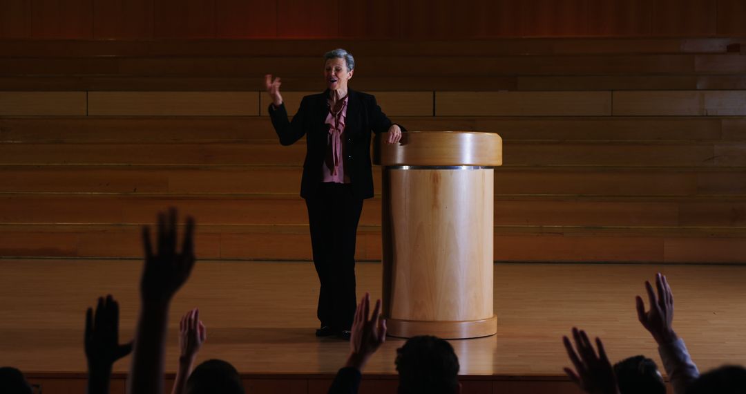 Confident Speaker Engaging Audience During Lecture - Free Images, Stock Photos and Pictures on Pikwizard.com