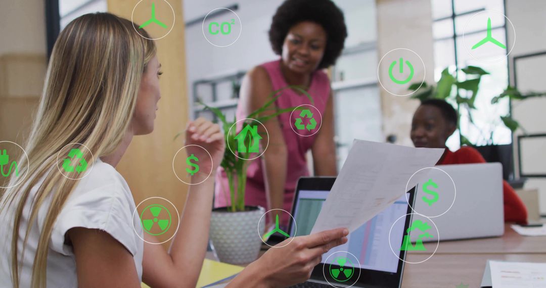 Diverse Female Team Collaborating on Sustainable Projects in Modern Office