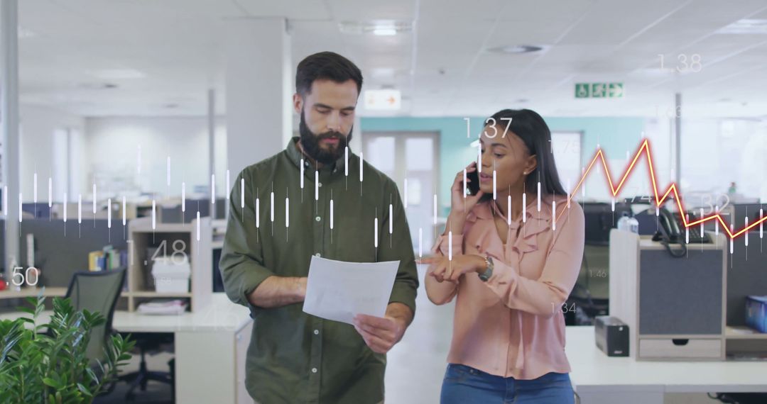 Colleagues Analyzing Financial Data in Modern Office Technology Overlay