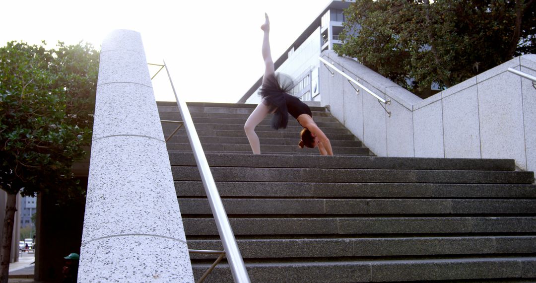 Ballerina Practicing Dance Moves on Outdoor Stairs - Free Images, Stock Photos and Pictures on Pikwizard.com