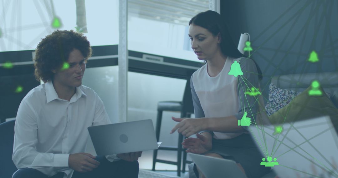 Colleagues Discussing Digital Strategy in Modern Office with Tech Icons