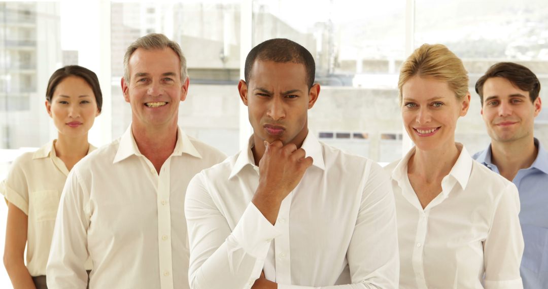 Diverse Business Team Standing Confidently at Modern Office