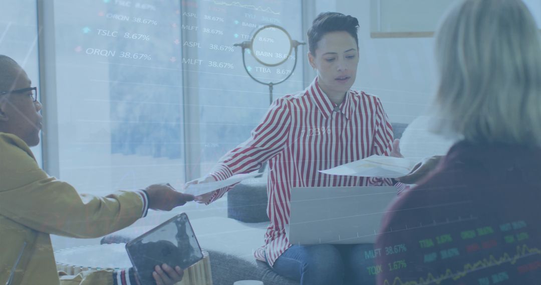 Diverse Team Collaborating with Stock Market Data