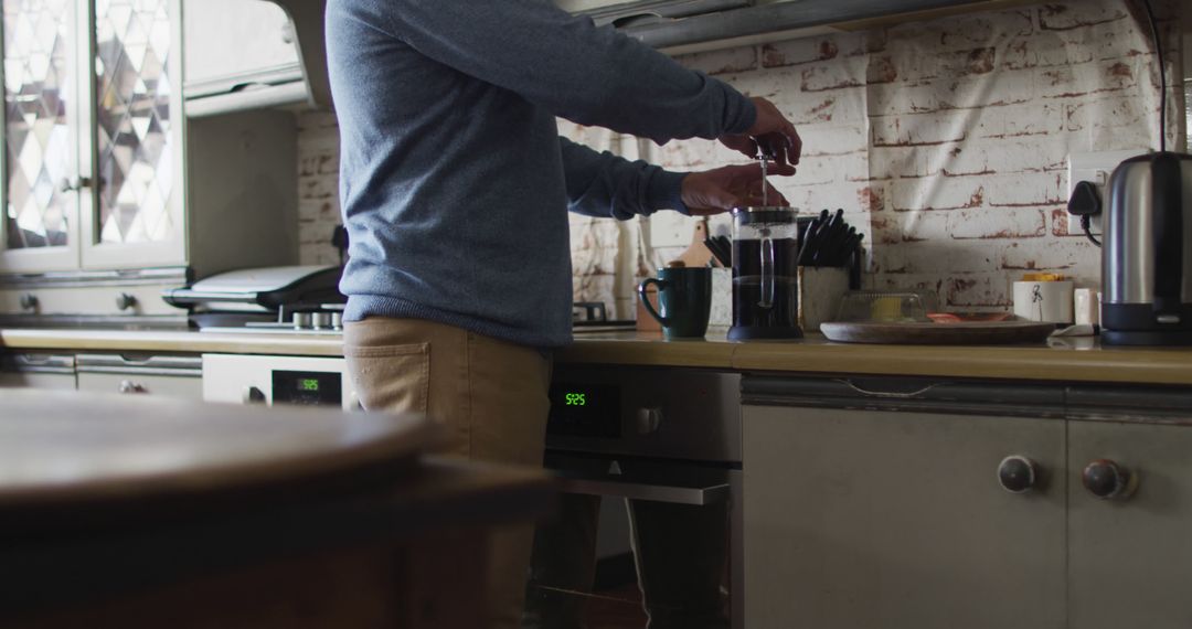 Man Brewing Coffee in Rustic Kitchen - Free Images, Stock Photos and Pictures on Pikwizard.com