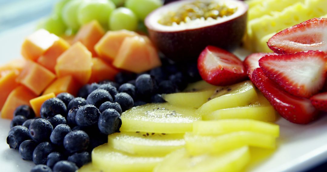 Close-up of Fresh Cut Tropical Fruits on White Plate - Free Images, Stock Photos and Pictures on Pikwizard.com