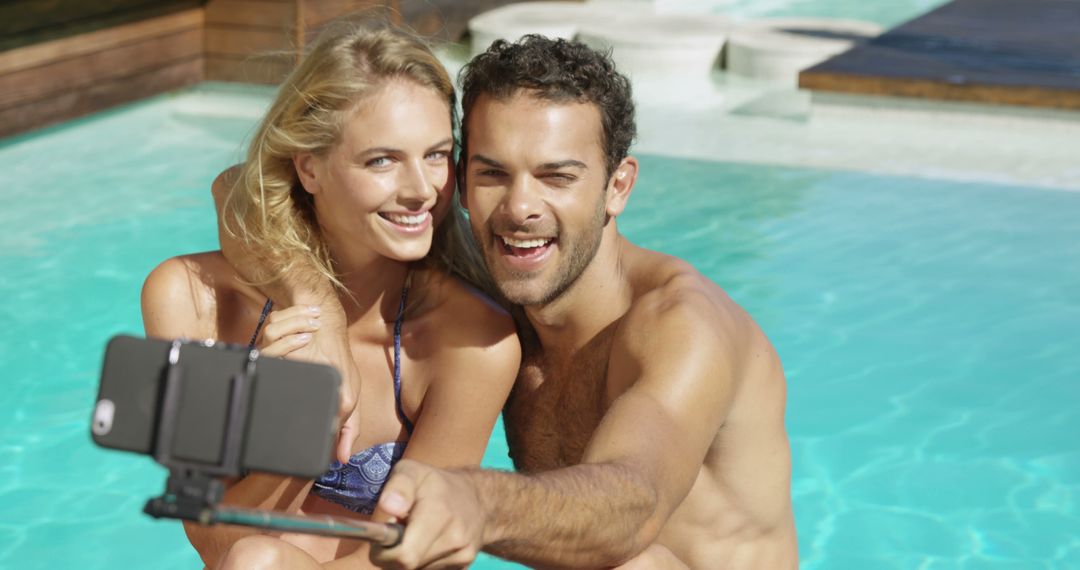 Happy Couple Taking Selfie by Swimming Pool on Sunny Day - Free Images, Stock Photos and Pictures on Pikwizard.com