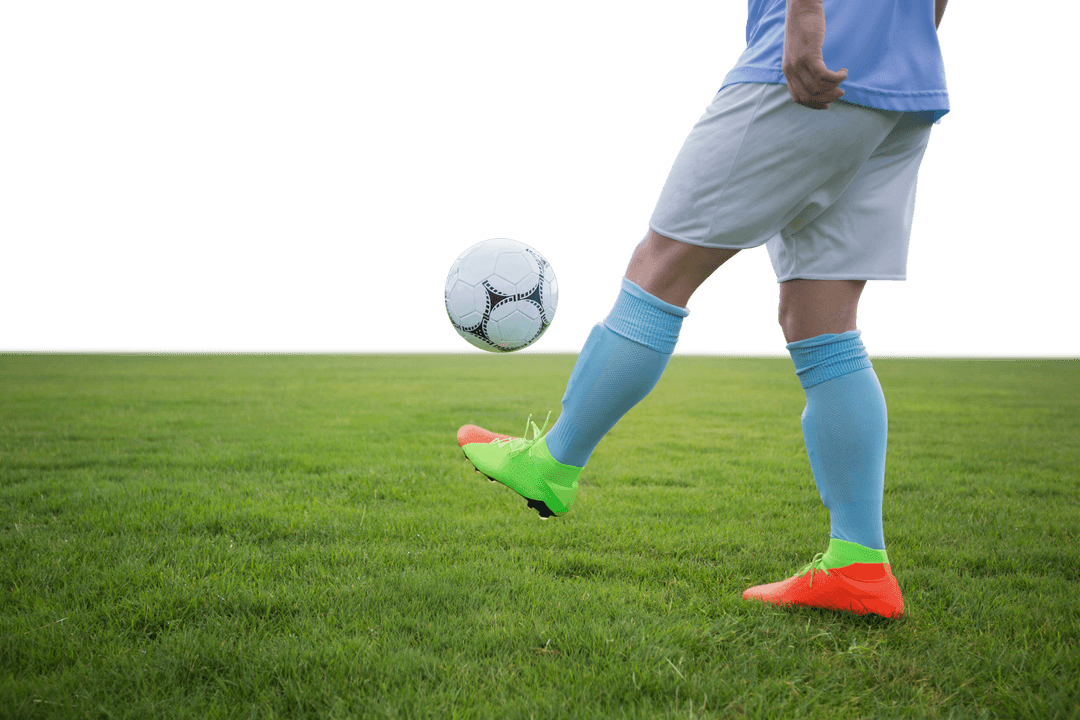 Young Soccer Player Kicking Ball with Transparent Background