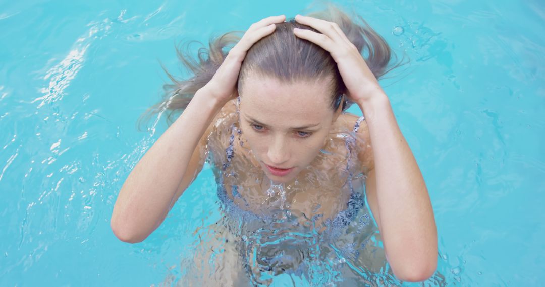 Woman Enjoying Refreshing Swim in Pool - Free Images, Stock Photos and Pictures on Pikwizard.com