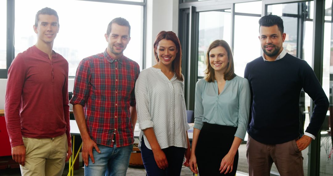Business Team Smiling in Modern Office Environment