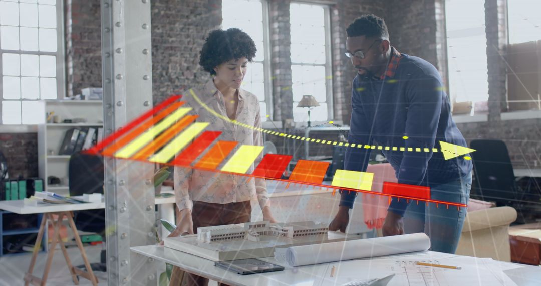 Diverse Team Examining Data Graph in Modern Office Environment