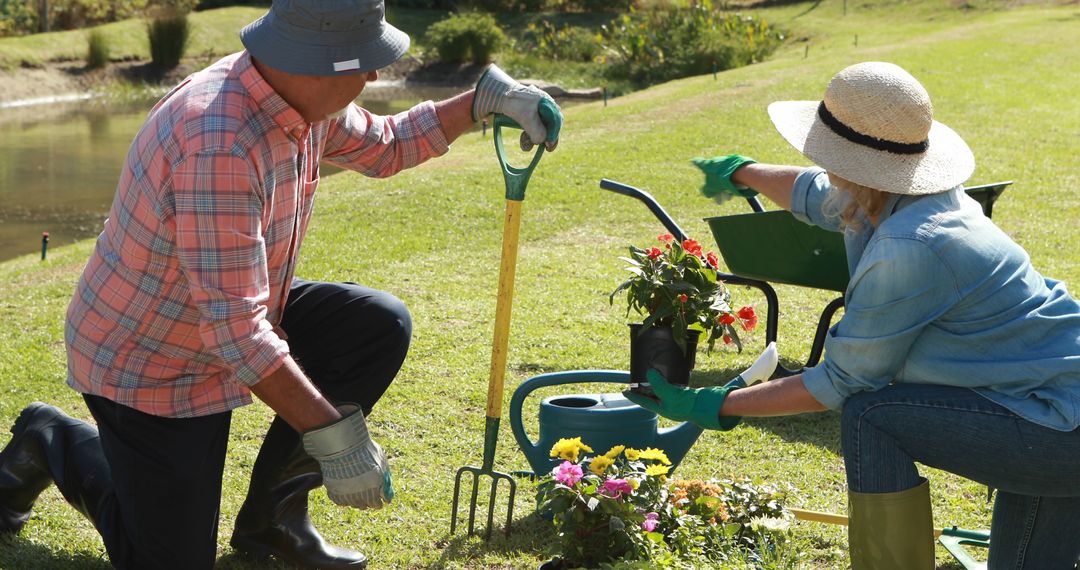 Senior Couple Gardening and Planting Flowers Outdoors - Free Images, Stock Photos and Pictures on Pikwizard.com