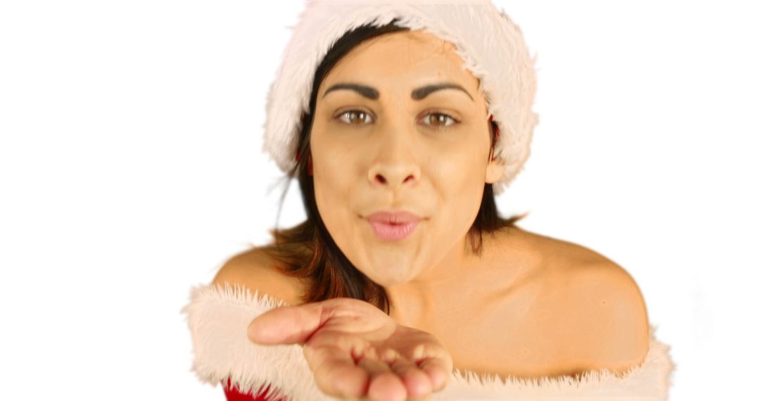 Festive Woman Blowing a Kiss in Santa Hat on White Background - Free Images, Stock Photos and Pictures on Pikwizard.com