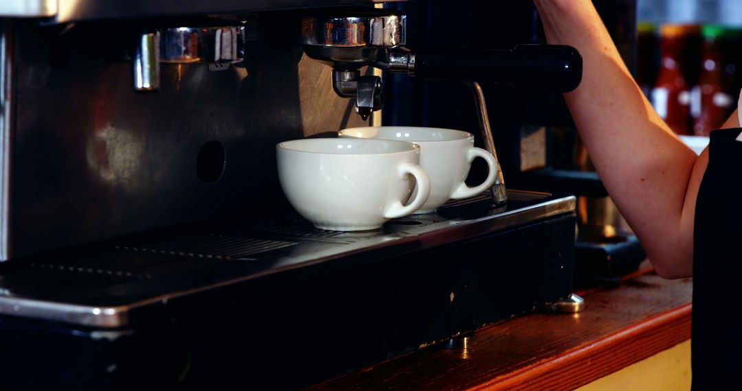 Barista Preparing Espresso with Dual Spout Espresso Machine - Free Images, Stock Photos and Pictures on Pikwizard.com