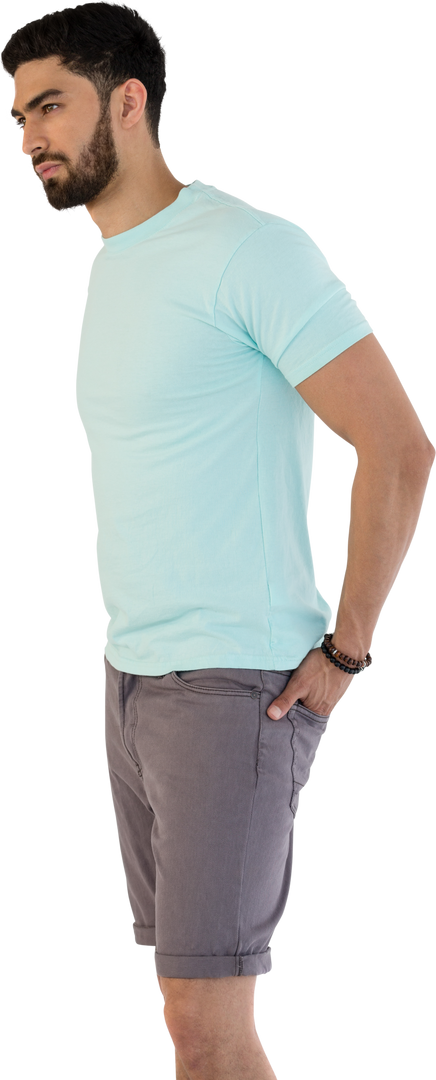 Fashionable man standing with hands in pockets wearing turquoise shirt, grey shorts - Download Free Stock Images Pikwizard.com