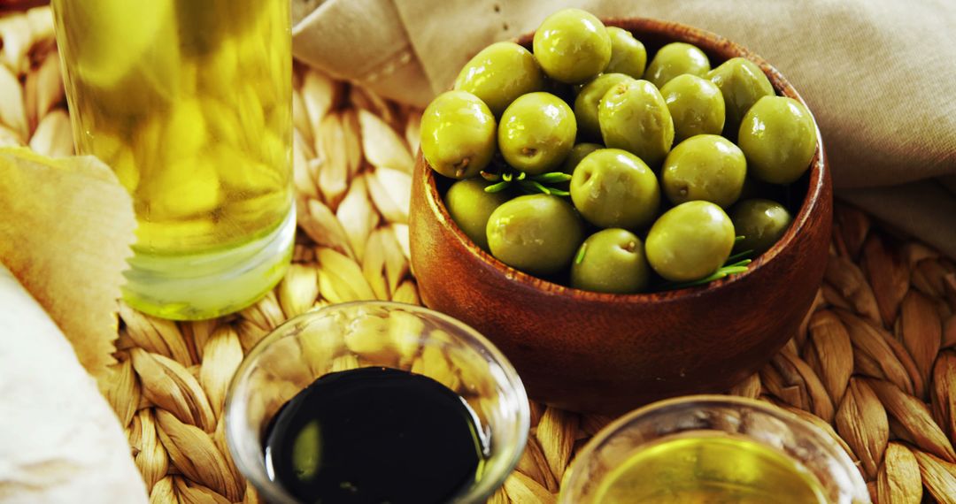 Close-Up of Fresh Olives and Olive Oil on Rustic Table - Free Images, Stock Photos and Pictures on Pikwizard.com