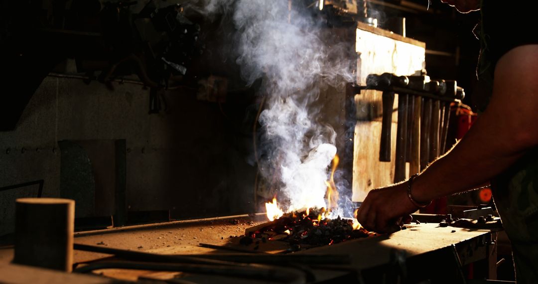 Blacksmith Crafting with Fire in Workshop at Night