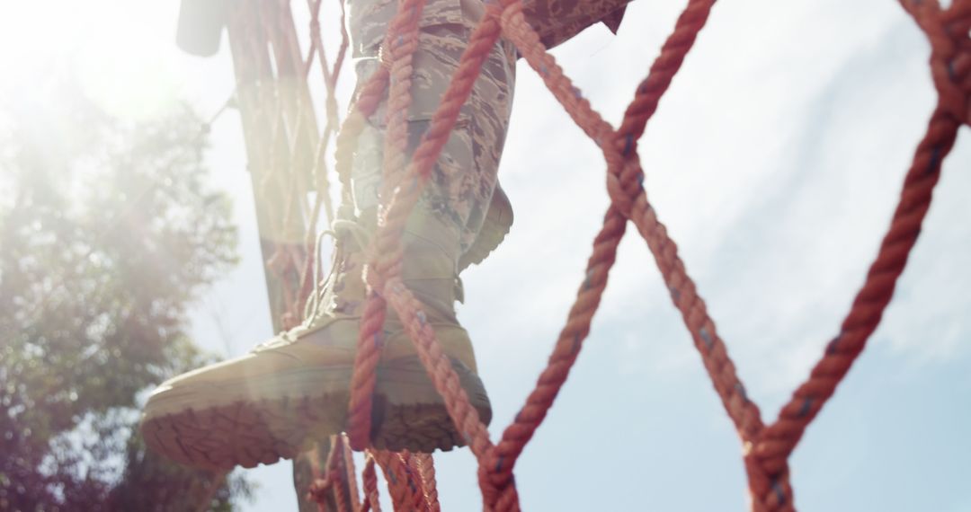 Child's Feet on Rope Ladder in Sunlit Playground
