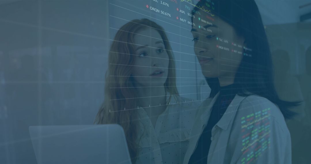 Diverse Colleagues Discussing Financial Data on Laptop in Office