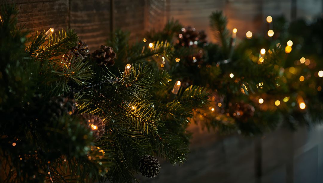 Cozy Evergreen Garland Draping Mantel with Pinecones and Warm LED Lights, Bokeh Glow