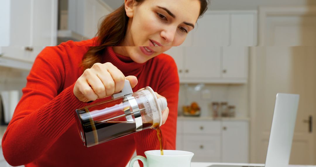 Woman Pouring Fresh Coffee from French Press into Mug in Modern Kitchen - Free Images, Stock Photos and Pictures on Pikwizard.com