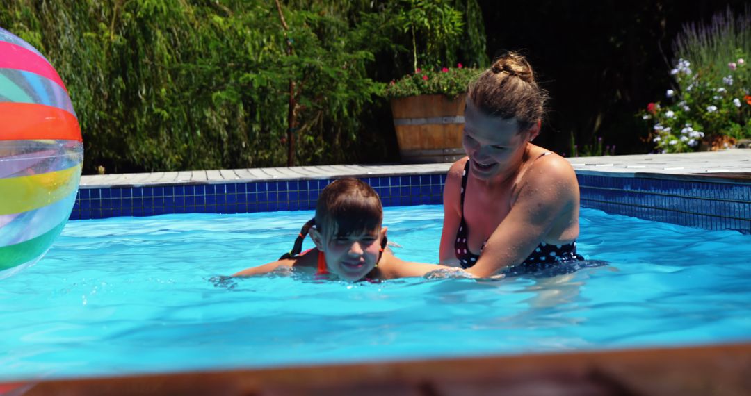 Mother Teaching Son to Swim in Outdoor Pool - Free Images, Stock Photos and Pictures on Pikwizard.com