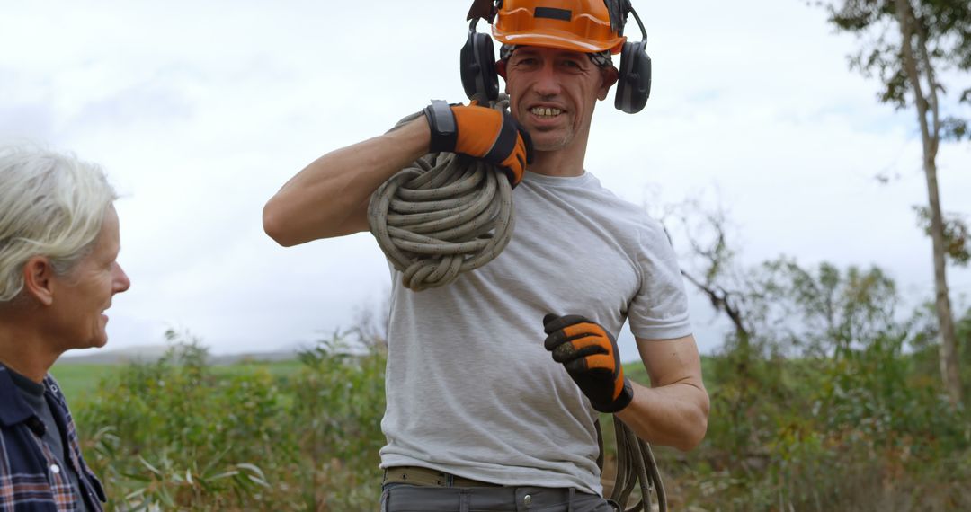 Lumberjack Carrying Rope in Countryside Forest - Free Images, Stock Photos and Pictures on Pikwizard.com