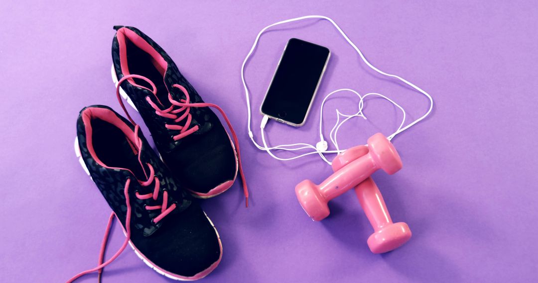 Pair of Sneakers, Dumbbells and Smartphone on Purple Background - Free Images, Stock Photos and Pictures on Pikwizard.com