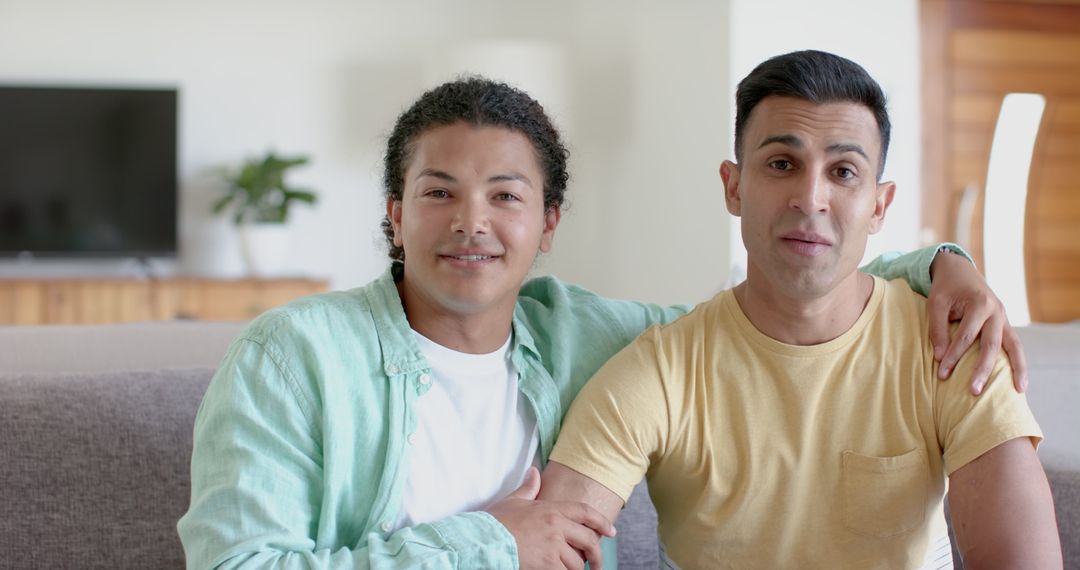 Diverse Gay Couple Enjoying Virtual Conversation at Home