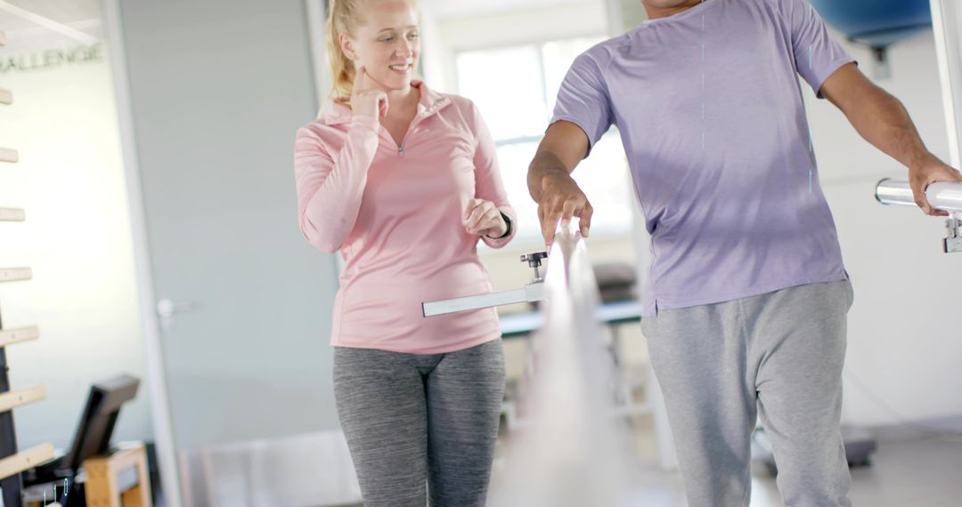 Rehabilitation walking training on parallel bars with wearable tracker and therapist