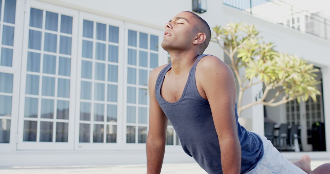 Man Practicing Outdoor Yoga in Bright Sunlight - Free Images, Stock Photos and Pictures on Pikwizard.com