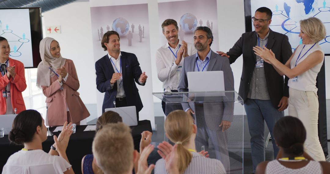 Diverse Team Applauding Businessman's Speech at Conference - Free Images, Stock Photos and Pictures on Pikwizard.com