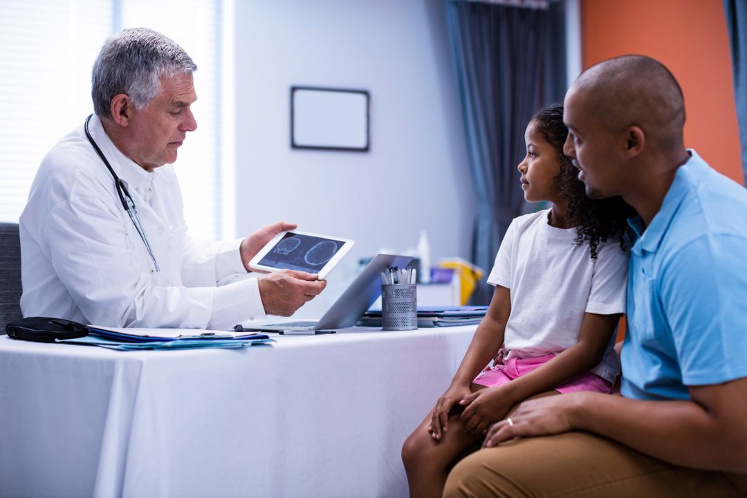 Doctor using digital tablet while interacting with patient - Free Images, Stock Photos and Pictures on Pikwizard.com