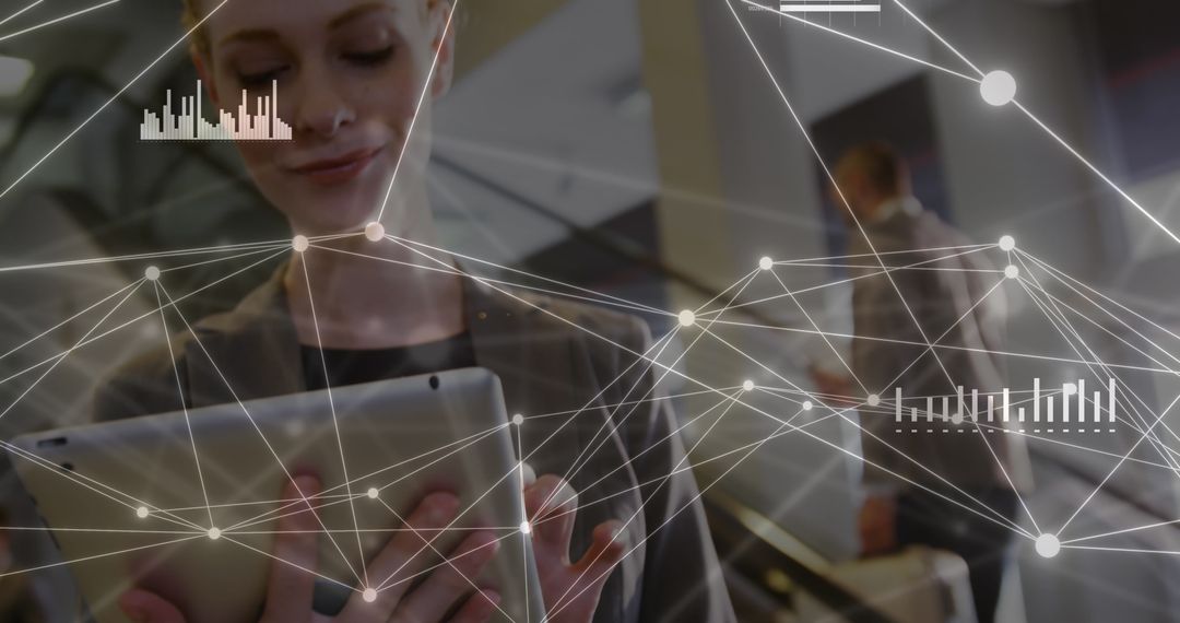 Businesswoman Using Tablet for Network Connections and Data Analysis