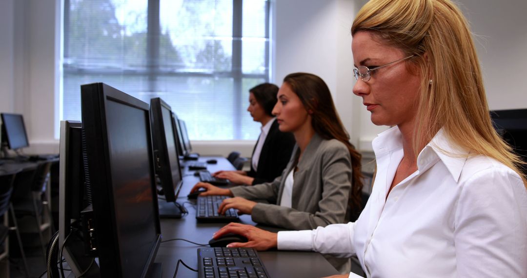 Professional Women Working in Computer Lab on Digital Projects - Free Images, Stock Photos and Pictures on Pikwizard.com