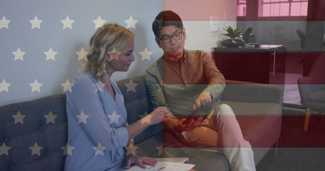 Diverse Business Partners Discussing Plans with USA Flag Overlay