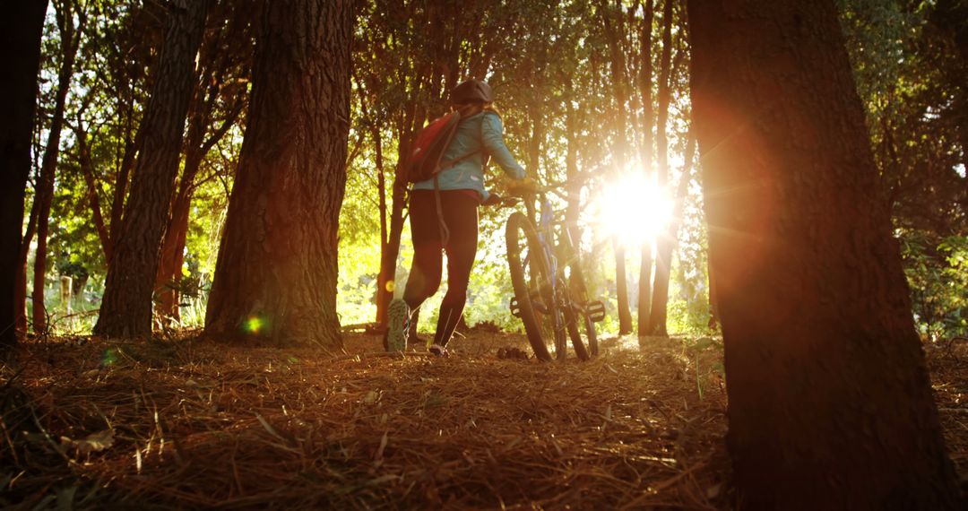 Young Woman Enjoying Tranquil Forest Bike Adventure